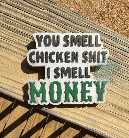 You smell chicken shit i smell money