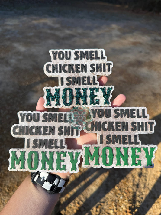 You smell chicken shit i smell money